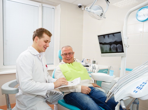 Man smiling at the dentist
