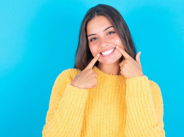 Cosmetic dentistry patient being shade-matched for dental bonding