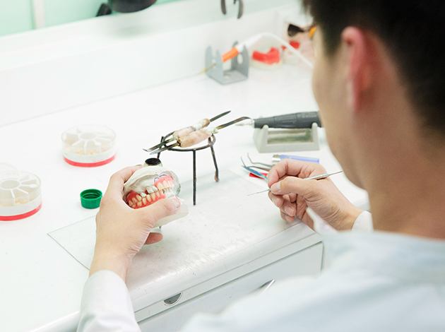 Dentist building a set of dentures