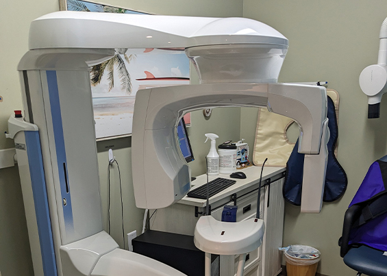 Cone beam C T scanner against dental office wall