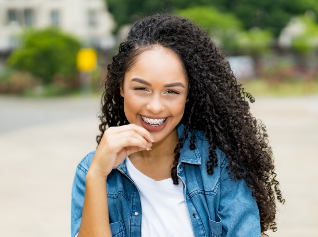 Young woman smiling with traditional braces in San Ramon