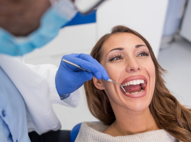 Woman receiving preventive dentistry checkup