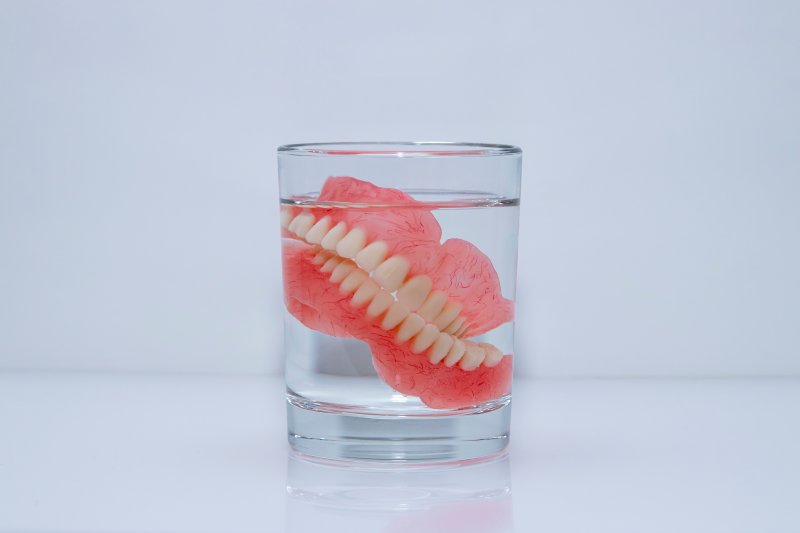 Dentures soak in glass
