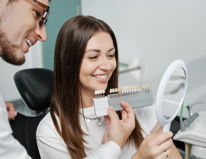 Dentist showing patient veneer shades